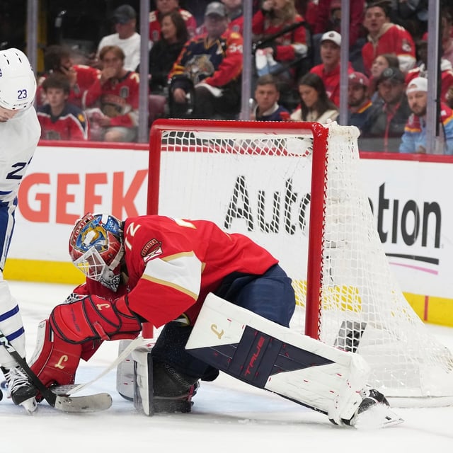 Florida Panthers goaltender Sergei Bobrovsky, right, defends the goal against Toronto Maple Leafs left wing Matthew Knies (23) during the second period in Game 6 of a second-round NHL hockey playoff series, Friday, May 16, 2025, in Sunrise, Fla. (AP Photo/Lynne Sladky)