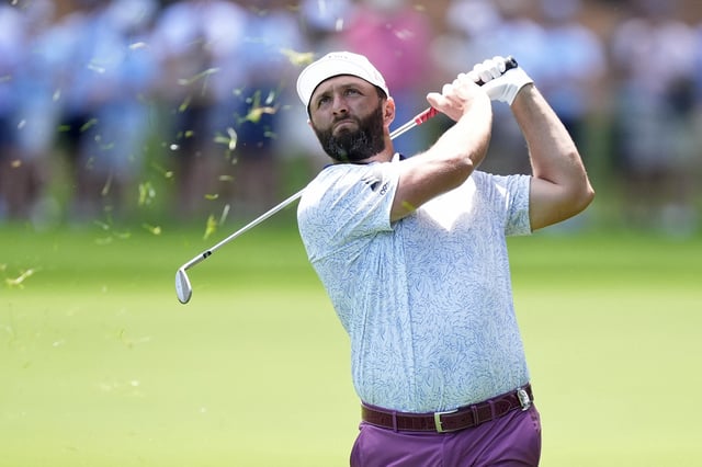 May 17, 2025; Charlotte, North Carolina, USA; Jon Rahm hits his second shot on the second hole during the third round of the PGA Championship golf tournament at Quail Hollow. Mandatory Credit: Jim Dedmon-Imagn Images