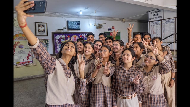 Students take a selfie as they celebrate after the declaration of Haryana Board of School Education Class 10 results in Gurugram on Saturday. (PTI)