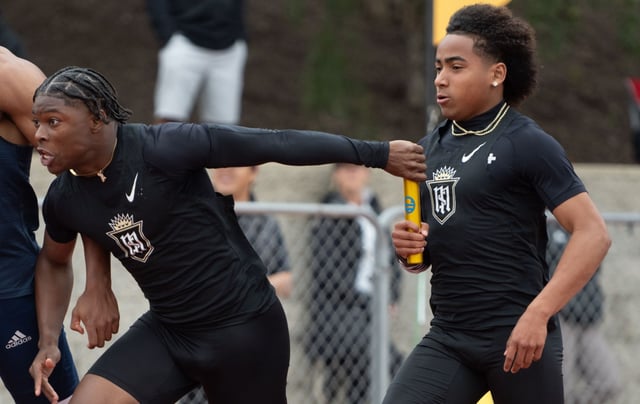 Servite’s Benjamin Harris takes the baton from teammate Jorden Wells in the boys Division 3 4×100 relay during the CIF Southern Section track and field finals at Moorpark High School in Moorpark on Saturday, May 17 2025. (Photo by Miguel Vasconcellos, Contributing Photographer)