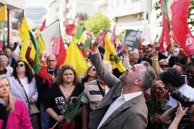 Socialist Party secretary general Pedro Nuno Santos waves to supporters during an election campaign action in Moscavide, on the outskirts of Lisbon, Friday, May 16, 2025, ahead of the May 18 general election. (AP Photo/Armando Franca)