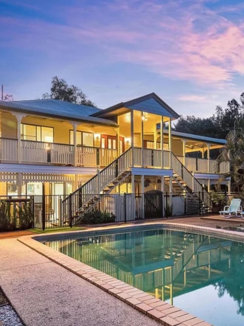 The waterfront Beachmere home forfeited to the Commonwealth after an AFP-led investigation into suspected proceeds of crime, including cryptocurrency theft and cyber hacking. Photo: Supplied/AFP