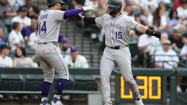 The Colorado Rockies’ Hunter Goodman (15) celebrates with Ezequiel Tovar (14) after a home run against the Arizona Diamondbacks during the first inning at Chase Field on Saturday, May 17, 2025, in Phoenix. (Christian Petersen/Getty Images/TNS)