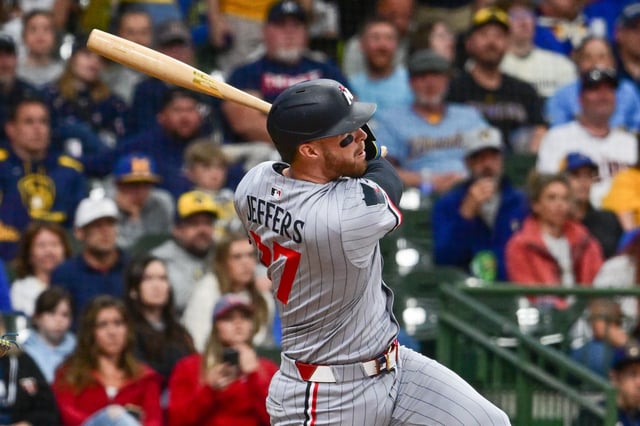 May 17, 2025; Milwaukee, Wisconsin, USA;  Minnesota Twins designated hitter Ryan Jeffers (27) hits a double in the third inning against the Milwaukee Brewers at American Family Field. Benny Sieu-Imagn Images