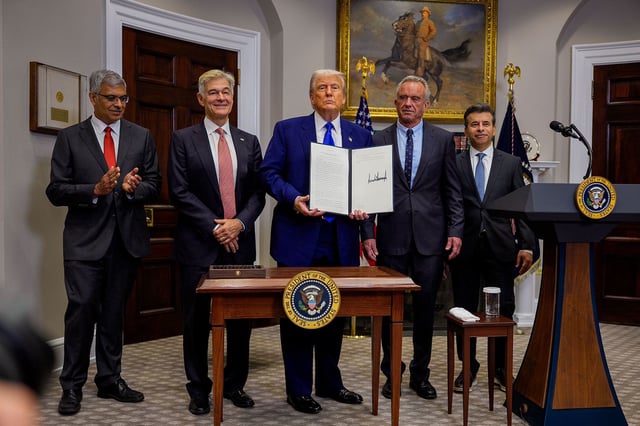 National Institutes of Health Director Jay Bhattacharya, Administrator for the Centers for Medicare & Medicaid Services Mehmet Oz, President Donald Trump, Health and Human Services Secretary Robert F. Kennedy Jr., and Food and Drug Administration Commissioner Martin Makary stand together after Trump signed an executive order aimed at reducing the cost of prescription drugs and pharmaceuticals by 30% to 80% during an event in the Roosevelt Room of the White House on May 12 in Washington, DC.