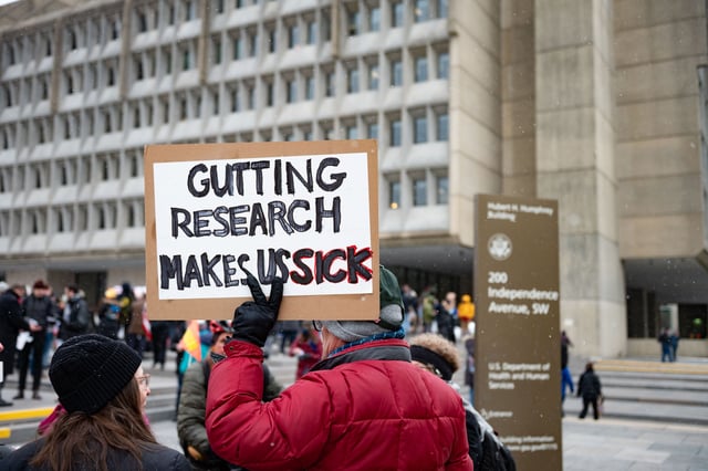 Federal employees, elected officials and supporters rally outside the Department of Health and Human Services to protest workforce reductions under the Department of Government Efficiency on February 19, 2025.
