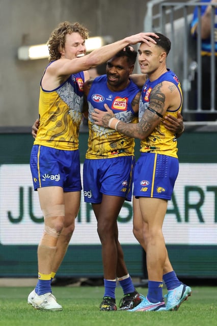 Jayden Hunt, Liam Ryan and Tyler Brockman celebrate.