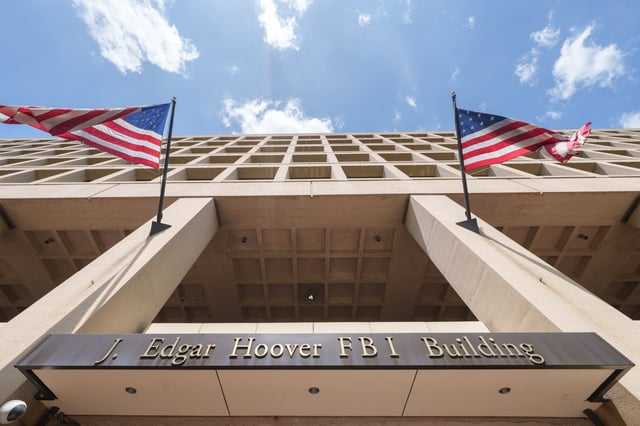 A bronze sign identifies the Federal Bureau of Investigation (FBI) headquarters building on April 30, 2025, in Washington, DC.  The agency issued an update May 16, 2025, on the New Orleans mass prison break.