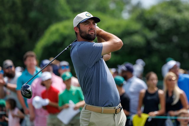 Masters champion Scottie Scheffler hits off the first tee as he starts a practice round at the Augusta National Golf Club in Augusta, Georgia, U.S., April 6, 2025. REUTERS/Mike Blake/File Photo