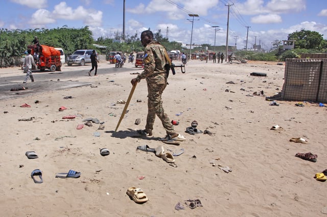 Security officer patrol near the scene of a suicide bomber attack in Mogadishu, Somalia Sunday, May 18, 2025. (AP Photo/Farah Abdi Warsameh)