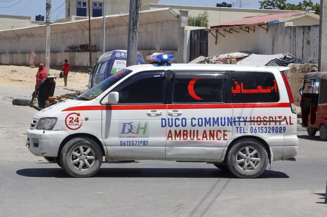 An ambulance is seen near the scene of a bomb attack in Mogadishu, Somalia Sunday, May 18, 2025. (AP Photo/Farah Abdi Warsameh)