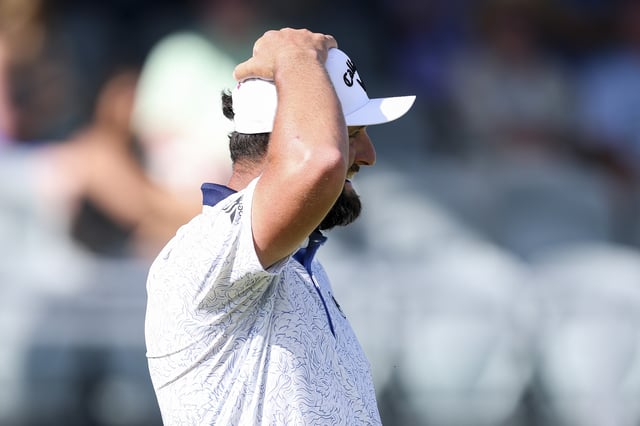 Jon Rahm of Spain reacts on the 18th green during the third round of the PGA Championship at Quail Hollow Country Club on May 17, 2025 in Charlotte, North Carolina.