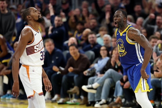 SAN FRANCISCO, CALIFORNIA - DECEMBER 28: Draymond Green #23 of the Golden State Warriors reacts after he made a three-point basket over Kevin Durant #35 of the Phoenix Suns in the first half at Chase Center on December 28, 2024 in San Francisco, California.