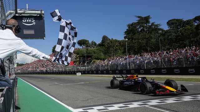 Red Bull Racing’s driver Max Verstappen crosses the finish line during the 2025 Emilia Romagna Formula One Grand Prix at the Imola autodrome in Imola, on May 18, 2025.