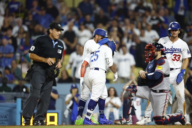 Kolten Wong #25 of the Los Angeles Dodgers hits a three-run home run against the Atlanta Braves in the eighth inning at Dodger Stadium on September 01, 2023 in Los Angeles.