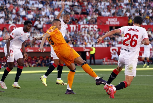 Soccer Football - LaLiga - Sevilla v Real Madrid - Ramon Sanchez Pizjuan, Seville, Spain - May 18, 2025  Real Madrid's Kylian Mbappe in action with Sevilla's Juanlu Sanchez REUTERS/Marcelo Del Pozo