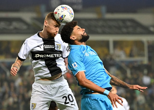 Soccer Football - Serie A - Parma v Napoli - Stadio Ennio Tardini, Parma, Italy - May 18, 2025 Parma's Antoine Hainaut in action with Napoli's Philip Billing REUTERS/Alberto Lingria