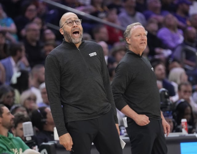 Phoenix Suns assistant coach David Fizdale yells out instructions in front of head coach Mike Budenholzer during the second quarter against the Toronto Raptors at PHX Arena on March 17, 2025.