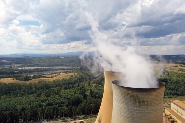 Cooling towers at EnergyAustralia Holdings Ltd.&#39;s Yallourn Power Station in the Latrobe Valley, Victoria, Australia, on Tuesday, Jan. 17, 2023. Elon Musk helped accelerate a transformation of Australias electricity grid to replace fossil fuels with clean power  now it&#39;s a testing ground for global climate action. Photographer: Carla Gottgens/Bloomberg via Getty Images