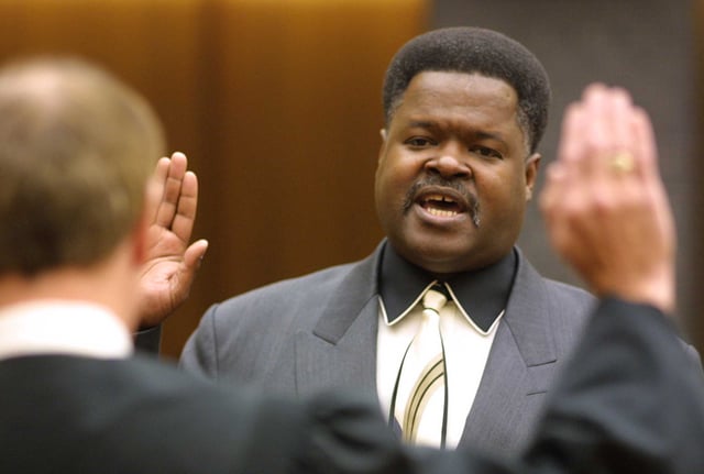 Federal Glover is sworn into office as Contra Costa County’s first Black supervisor by Judge Garrett Jay Grant in August 2001.
 