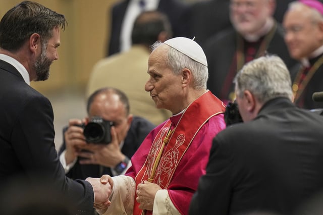 Pope Leo XIV meets Vice President JD Vance after the formal inauguration of his pontificate in St. Peter's Square, at the Vatican, Sunday, May 18, 2025. (AP Photo/Alessandra Tarantino)