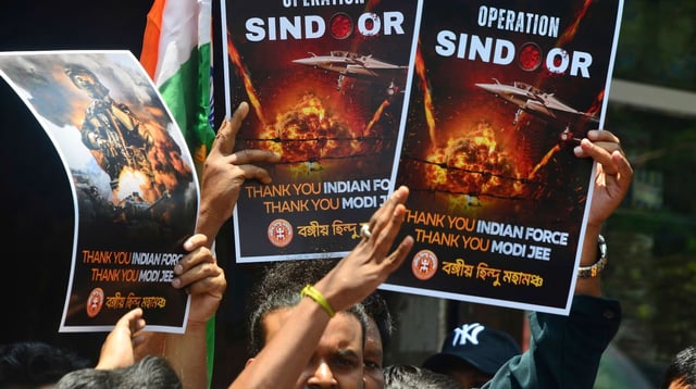 Demonstrators wave posters and the Indian flag in support of missile strikes against targets in Pakiistan and Pakistan-controlled Kashmir, in Siliguri, India, May 7, 2025 (photo by Diptendu Dutta for NurPhoto via AP).