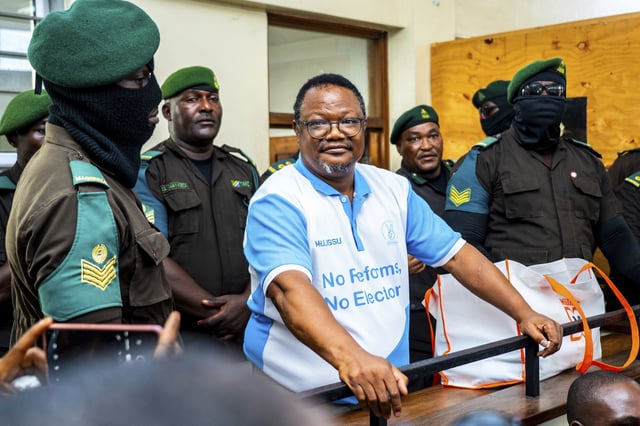 Tanzania's main opposition leader Tundu Lissuat, centre, appears at Kisutu magistrate's court in Dar es Salaam, Tanzania Monday, May 19, 2025. (AP Photo/Derick Katunzi)