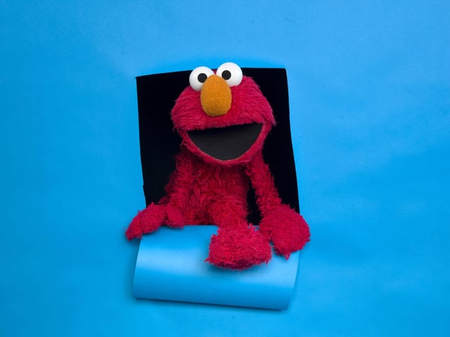 FILE - Elmo of the film "Being Elmo" poses for a portrait in the Fender Music Lodge during the 2011 Sundance Film Festival in Park City, Utahm Jan. 24, 2011. (AP Photo/Victoria Will, File)