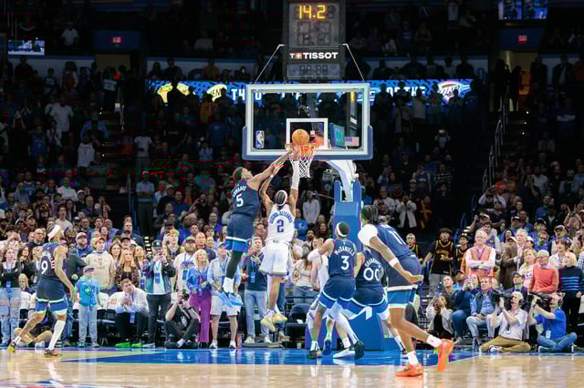 Anthony Edwards #5 of the Minnesota Timberwolves blocks a shot by Shai Gilgeous-Alexander #2 of the Oklahoma City Thunder during overtime at Paycom Center on February 24, 2025 in Oklahoma City, Oklahoma.
