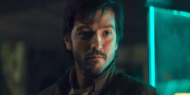 Cassian Andor (Diego Luna), smirks inside the Rebel Base on Yavin 4 in Rogue One: A Star Wars Story.