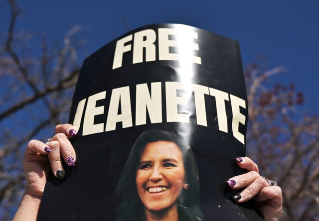 A woman, who did not want her face shown or to be identified, protests outside the GEO Aurora ICE Processing Center in Aurora on March 18, 2025. Immigration activist Jeanette Vizguerra was detained by ICE agents on Monday and placed in the facility. (Photo by RJ Sangosti/The Denver Post)