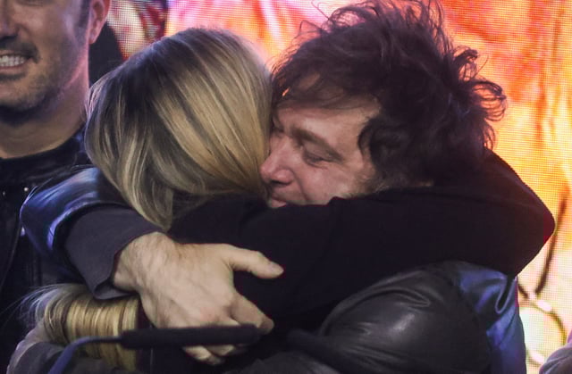 Argentina's President Javier Milei and his sister Karina Milei embrace onstage at the La Libertad Avanza party headquarters on the day of the legislative elections of the city of Buenos Aires, Argentina, May 18, 2025. REUTERS/Tomas Cuesta