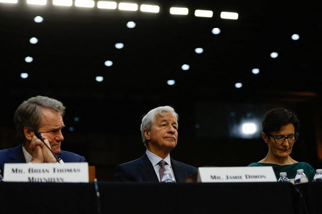 CEO Jamie Dimon (center) attends an Urban Affairs Committee oversight hearing on Wall Street firms with other banking leaders on Capitol Hill in Washington, U.S., December 6, 2023.