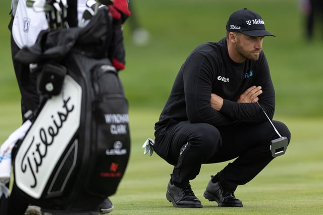 May 9, 2025; Philadelphia, Pennsylvania, USA; Wyndham Clark lines up a putt on the 12th hole during the second round of the Truist Championship golf tournament. Mandatory Credit: Bill Streicher-Imagn Images