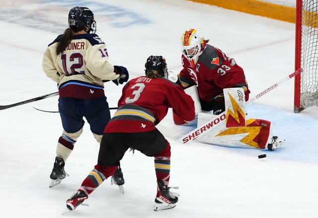 Ottawa Charge goaltender Gwyneth Philips (33) makes a pad save as Zoe Boyd (3) defends against Montreal Victoire's Jennifer Gardiner (12) during third period PWHL playoff hockey action in Ottawa, on Tuesday, May 13, 2025. THE CANADIAN PRESS/Justin Tang