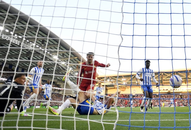 Soccer Football - Premier League - Brighton & Hove Albion v Liverpool - The American Express Community Stadium, Brighton, Britain - May 19, 2025 Liverpool's Harvey Elliott scores their first goal past Brighton & Hove Albion's Bart Verbruggen REUTERS/Tony O Brien