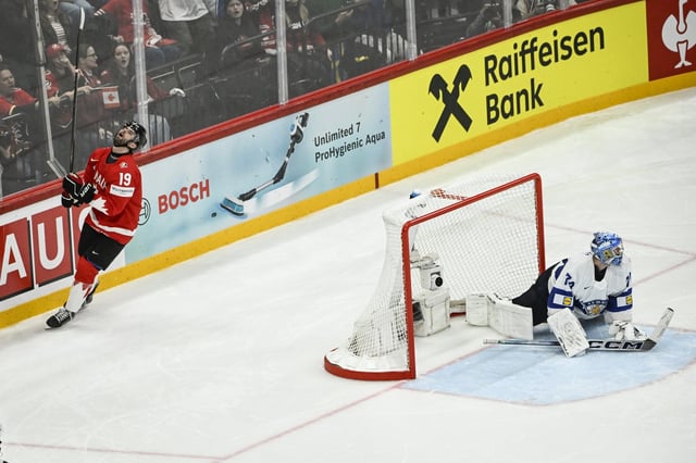 Canada's Adam Fantilli, left, reacts after missing his penalty shot against Finland's Juuse Saros during an IIHF Ice Hockey World Championship Group A match between Canada and Finland at Avicii Arena in Stockholm, Sweden, Monday, May 19, 2025. (Fredrik Sandberg/TT News Agency via AP)