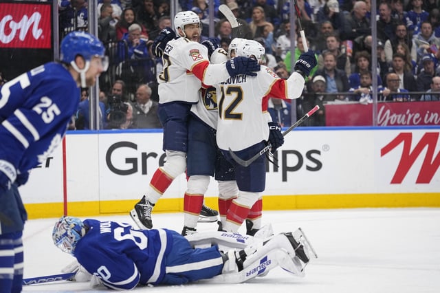 May 18, 2025; Toronto, Ontario, CAN; Florida Panthers forward A.J. Greer (10) celebrates a goal by forward Jonah Gadjovich (12) as Toronto Maple Leafs goaltender Joseph Woll (60) lies on the ice during the second period of game seven of the second round of the 2025 Stanley Cup Playoffs at Scotiabank Arena. Mandatory Credit: John E. Sokolowski-Imagn Images