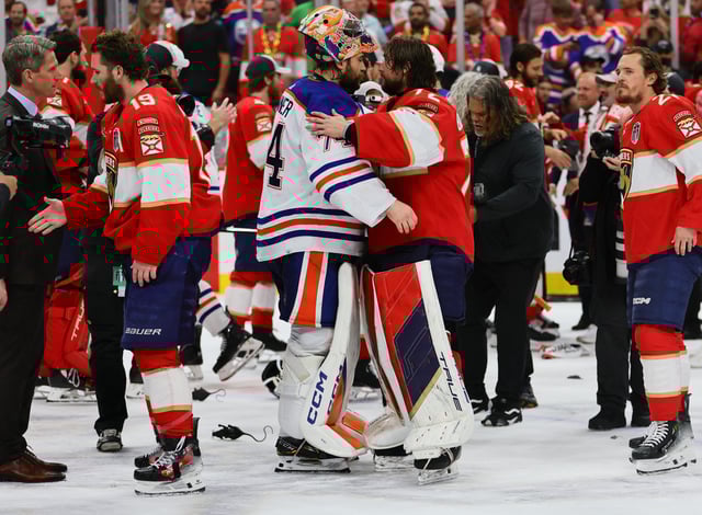 Edmonton Oilers goaltender Stuart Skinner (74) and Florida Panthers goaltender Sergei Bobrovsky (72) shake hands after the Panthers' win in Game 7 of the 2024 Stanley Cup Final.