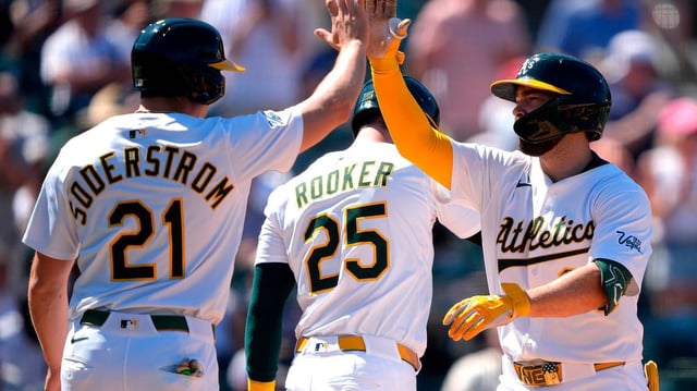 Shea Langeliers (23) of the Athletics is congratulated by Tyler Soderstrom (21) and Brent Rooker (25) after Langeliers’ hit a three-run home run against the New York Yankees in the bottom of the seventh inning at Sutter Health Park on May 10, 2025, in Sacramento, California. (Thearon W. Henderson/Getty Images/TNS)