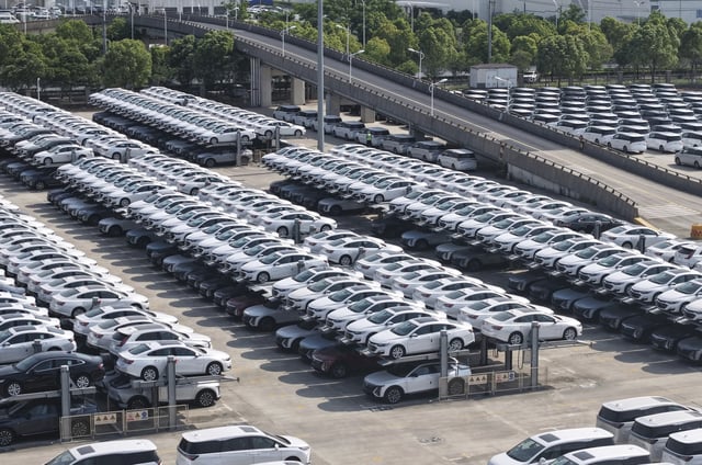 New cars wait for shipment at the logistics center of a plant of SAIC-GM in Shanghai, China Monday, May 05, 2025.