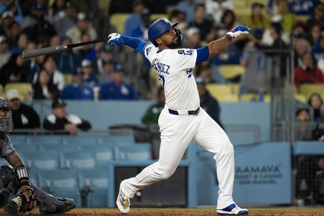 Dodgers’ Teoscar Hernández bats during a baseball game against the Miami Marlins in Los Angeles, Monday, April 28, 2025. (AP Photo/Kyusung Gong)