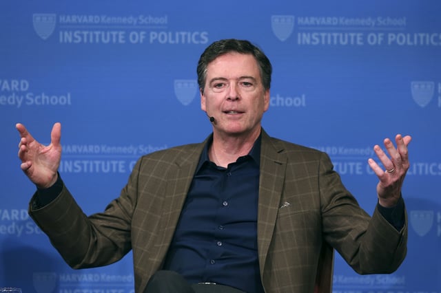 FILE - Former FBI director James Comey gestures while speaking at Harvard University's Institute of Politics' JFK Jr. Forum in Cambridge, Mass., Feb. 24, 2020. (AP Photo/Charles Krupa, File)