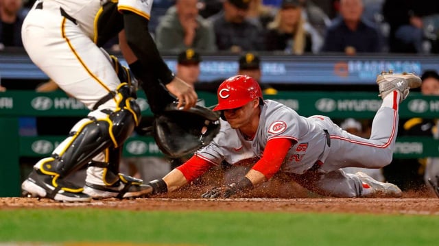 TJ Friedl (29) of the Cincinnati Reds scores on a double off the bat of Elly De La Cruz in the eighth inning against the Pittsburgh Pirates at PNC Park on Monday, May 19, 2025, in Pittsburgh. (Justin K. Aller/Getty Images/TNS)