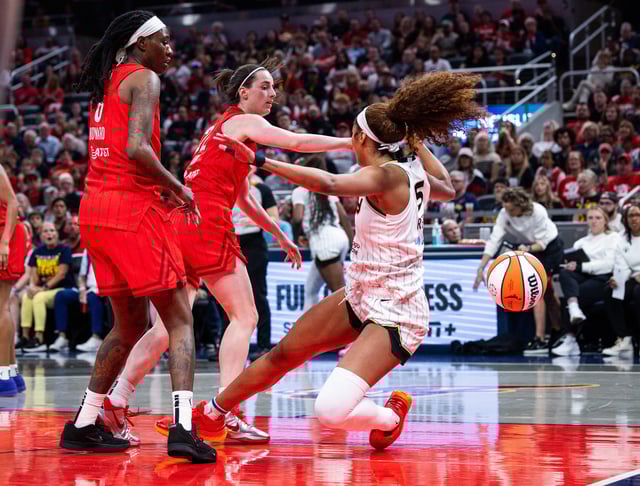 Indiana Fever guard Caitlin Clark fouls Chicago Sky forward Angel Reese in the second half at Gainbridge Fieldhouse.