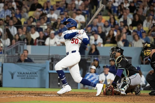 Dodgers’ Mookie Betts hits a solo home run during the sixth inning of a baseball game against the Arizona Diamondbacks in Los Angeles, Monday, May 19, 2025. (AP Photo/Kyusung Gong)