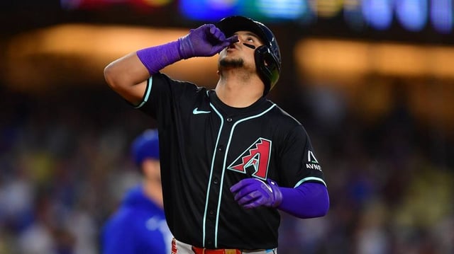 May 19, 2025; Los Angeles, California, USA;  Arizona Diamondbacks catcher Gabriel Moreno (14) celebrates after hitting a two run home run in the third inning against the Los Angeles Dodgers at Dodger Stadium. Mandatory Credit: Gary A. Vasquez-Imagn Images