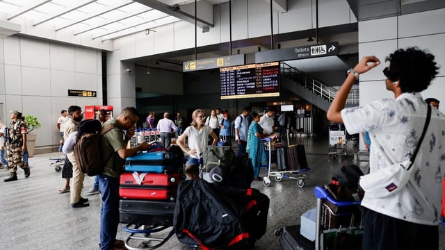 Passengers wait at Terminal 2 of Indira Gandhi International Airport in New Delhi, India, July 1, 2024. (Photo: Reuters) 