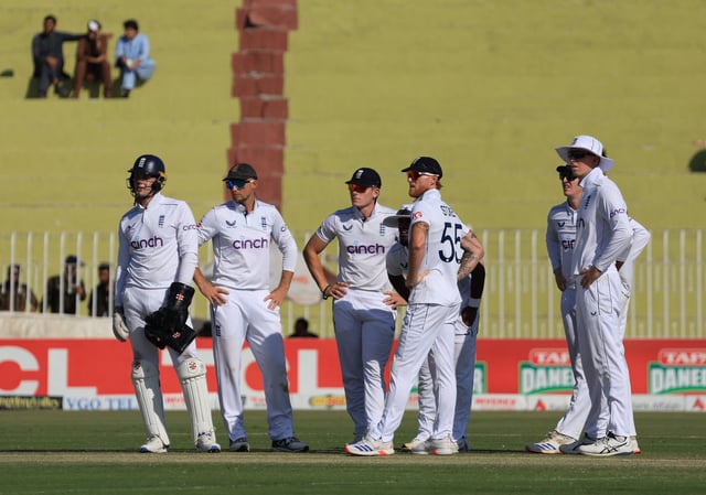 Cricket - Third Test - England v Pakistan - Rawalpindi Cricket Stadium, Rawalpindi, Pakistan - October 25, 2024  England's Joe Root and Ben Stokes with teammates during a review REUTERS/Akhtar Soomro/File Photo