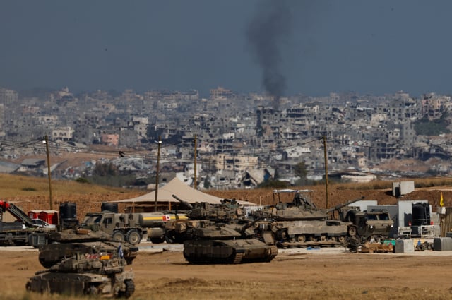 Military vehicles stand near the border with Gaza, in Israel, May 20, 2025. REUTERS/Amir Cohen